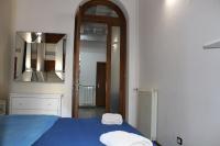 A bed or beds in a room at Gmax Guelfa Apartments