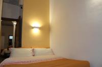 A bed or beds in a room at Gmax Guelfa Apartments