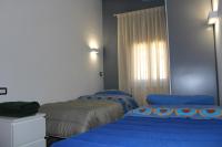 A bed or beds in a room at Gmax Guelfa Apartments