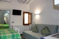 A television and/or entertainment centre at Gmax Guelfa Apartments