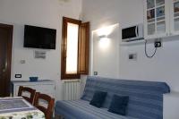 A television and/or entertainment centre at Gmax Guelfa Apartments