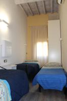 A bed or beds in a room at Gmax Guelfa Apartments