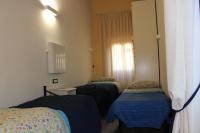A bed or beds in a room at Gmax Guelfa Apartments