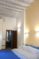 A bed or beds in a room at Gmax Guelfa Apartments