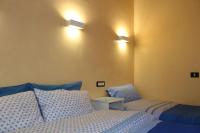 A bed or beds in a room at Gmax Guelfa Apartments