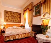 Łóżko lub łóżka w pokoju w obiekcie Hotel Europejski