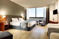 A bed or beds in a room at Exe Isla Cartuja