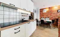 Kuchyňa alebo kuchynka v ubytovaní Wonder Home - Apartamenty w malowniczej okolicy, z balkonami i widokiem na góry
