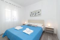 Posteľ alebo postele v izbe v ubytovaní Apartments Peca