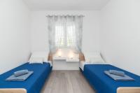 Posteľ alebo postele v izbe v ubytovaní Apartments Peca