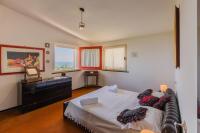 A bed or beds in a room at Villa Claudia