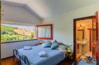 A bed or beds in a room at Villa Claudia