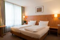 Postel nebo postele na pokoji v ubytování Hotel Mingarden