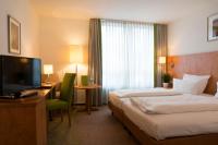 Postel nebo postele na pokoji v ubytování Hotel Mingarden