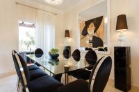 a dining room with a glass table and chairs at Arcos Gardens Sol Rent Golf in Arcos de la Frontera