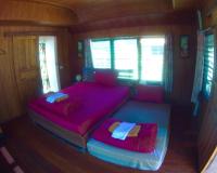 Postel nebo postele na pokoji v ubytování Jing Jo Boutique Bungalow