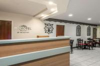 a view of a muroll restaurant with tables and chairs at Microtel Inn & Suites by Wyndham Auburn in Auburn