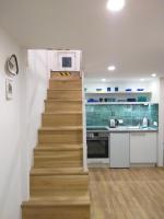 A kitchen or kitchenette at Tempo Life Apartman