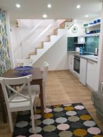 A kitchen or kitchenette at Tempo Life Apartman