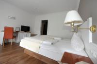 A bed or beds in a room at Villa Bucher - Metnitztalerhof
