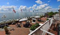 a balcony with a view of the water at AKZENT Strandhotels Seestern, Delphin &amp; Lachs in Wilhelmshaven