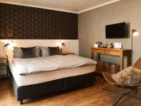 Postel nebo postele na pokoji v ubytování Dreimäderlhaus - Das vegetarische Boutique Hotel