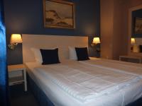 Postel nebo postele na pokoji v ubytování Hotel Pelikan