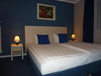 Postel nebo postele na pokoji v ubytování Hotel Pelikan