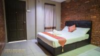 SANDY GARDEN RESORT LANGKAWIにあるベッド
