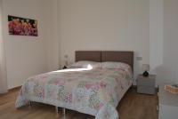 Posteľ alebo postele v izbe v ubytovaní Vittori Apartment