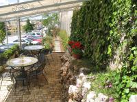 A garden outside Hotel Vittoria