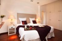 A bed or beds in a room at Villa Gaudi