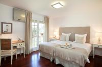 A bed or beds in a room at Villa Gaudi