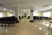 a large room with chairs and tables in a building at Klein Ville São Leopoldo in São Leopoldo