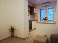 Kuchyňa alebo kuchynka v ubytovaní Apartmani Dina