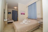 Posteľ alebo postele v izbe v ubytovaní Flisvos Rooms
