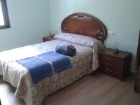 Postel nebo postele na pokoji v ubytování Casa Rosi. Cumbres borrascosas Brañuelas