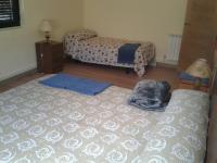 Postel nebo postele na pokoji v ubytování Casa Rosi. Cumbres borrascosas Brañuelas