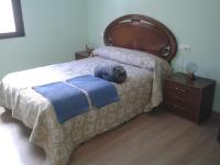 Postel nebo postele na pokoji v ubytování Casa Rosi. Cumbres borrascosas Brañuelas