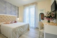 Posteľ alebo postele v izbe v ubytovaní Hotel Athena