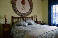 Cama o camas de una habitación en Hostal Rural Molino Del Bombo
