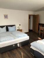 Postel nebo postele na pokoji v ubytování Hotel Guntia Boardinghouse