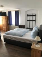Postel nebo postele na pokoji v ubytování Hotel Guntia Boardinghouse