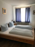 Postel nebo postele na pokoji v ubytování Hotel Guntia Boardinghouse