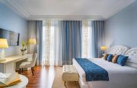 A bed or beds in a room at Grand Hotel Salsomaggiore