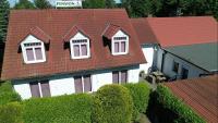 an overhead view of a house with a red roof at Pension Zum Lindeneck in Lübz