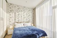 Asian Magnolia Boutique Apartmentsにあるベッド