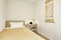 Asian Magnolia Boutique Apartmentsにあるベッド