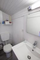 a bathroom with a toilet and a sink and a mirror at Capitole - Studio d&#39;amoureux sur les toits in Toulouse