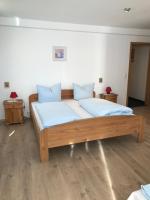 Postel nebo postele na pokoji v ubytování Hotel Guntia Boardinghouse